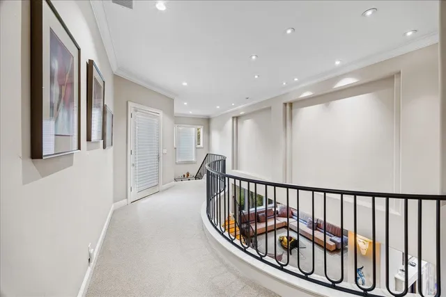 a front view of a house with a yard and fountain in middle of the garden