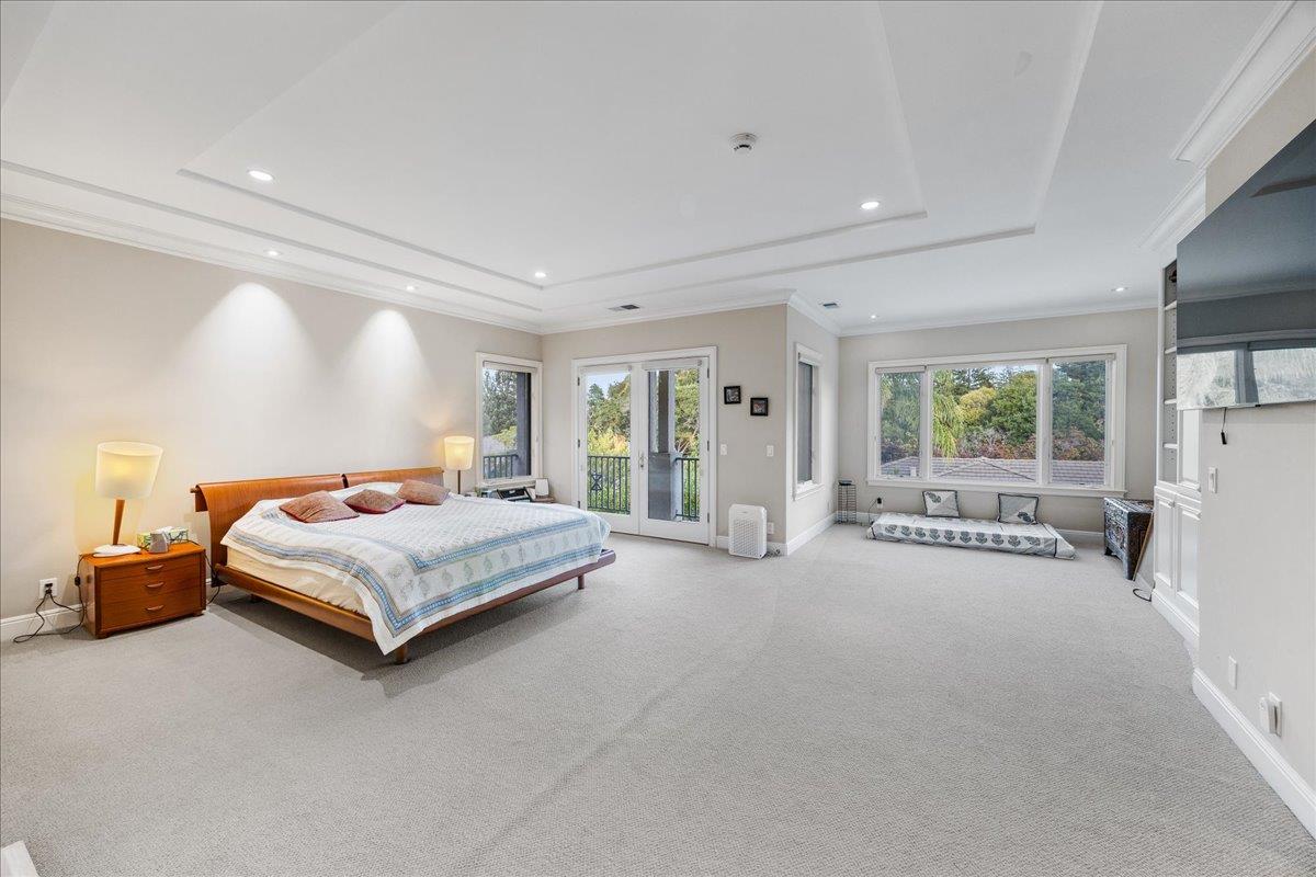20040 Spaich Court Saratoga, CA 95070 - Photo 39 of 87 a spacious bedroom with a bed and a large window