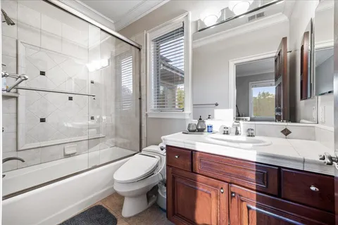 an aerial view of residential house with outdoor space and swimming pool