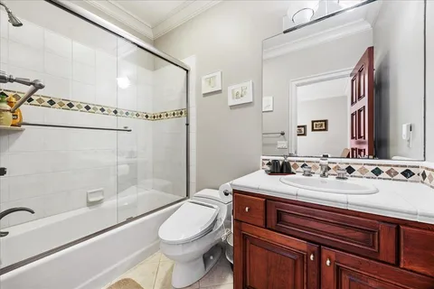 a front view of a house with sitting area and swimming pool