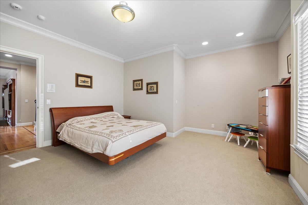 20040 Spaich Court Saratoga, CA 95070 - Photo 48 of 87 a bedroom with a bed and a table in it