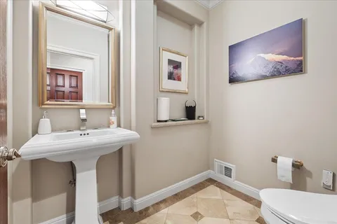 a view of a patio with a table chairs and a yard