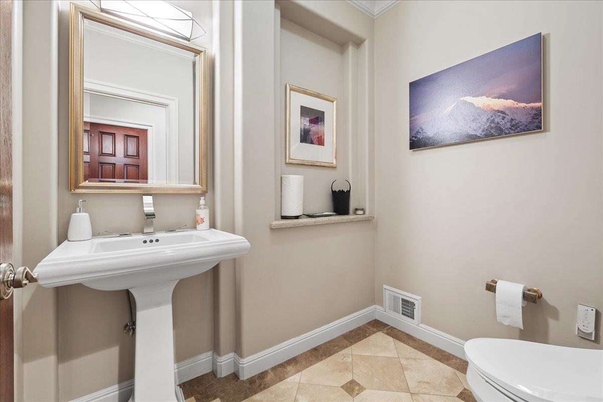 20040 Spaich Court Saratoga, CA 95070 - Photo 49 of 87 a bathroom with a sink and mirror with toilet