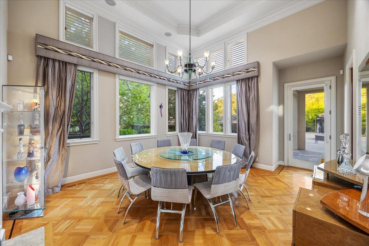 20040 Spaich Court Saratoga, CA 95070 - Photo 52 of 87 a dining room with furniture a chandelier and a rug