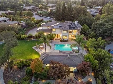 a front view of a residential apartment building with a yard