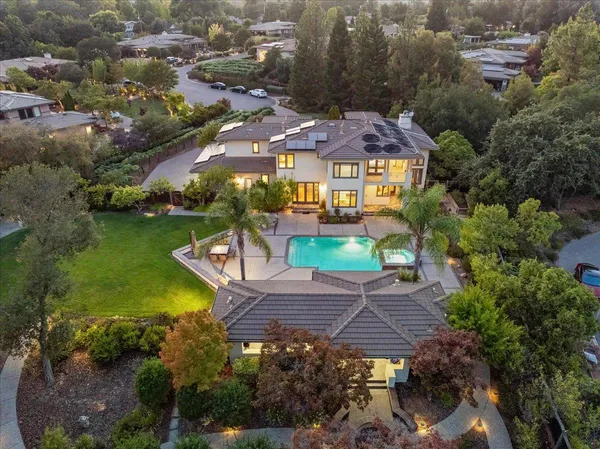 a front view of a residential apartment building with a yard