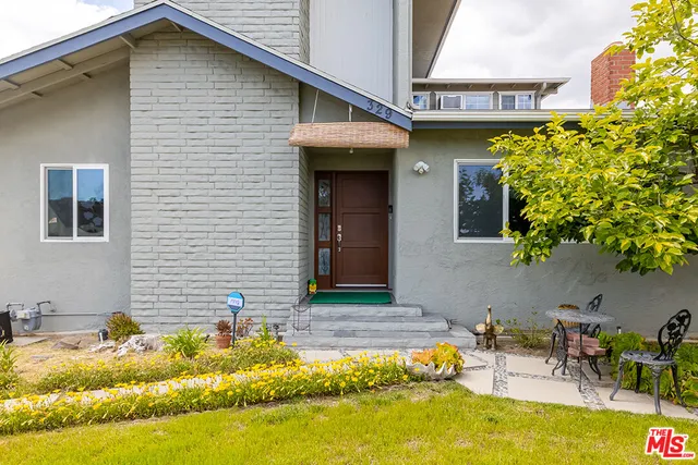 a front view of a house with swimming pool