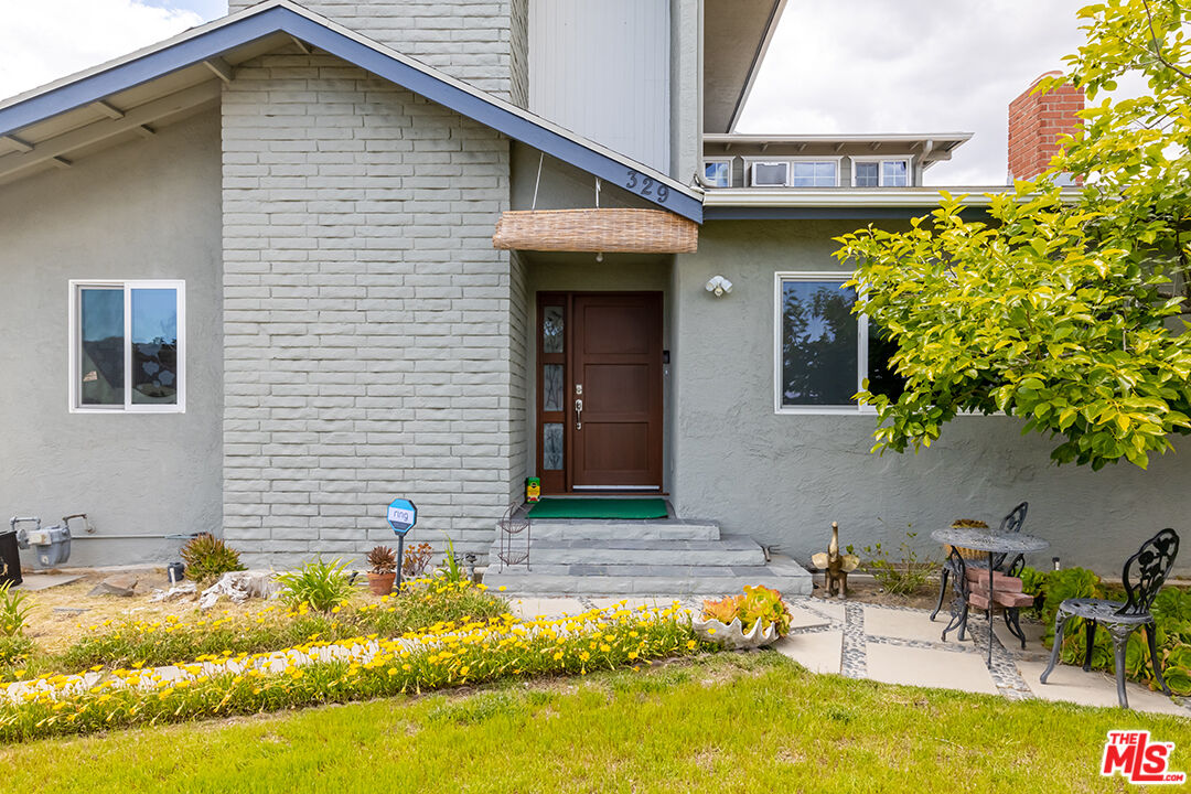 a front view of a house with swimming pool