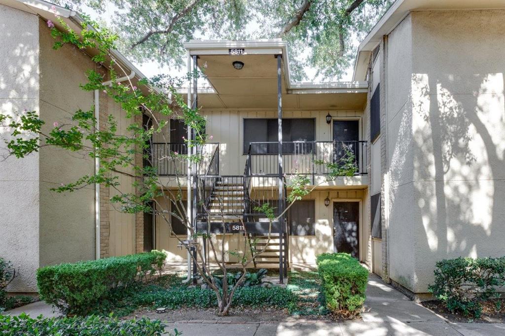 5811 Harvest Hill Road, Unit 2056 Dallas, TX 75230 - Photo 1 of 1 a front view of a house with plants
