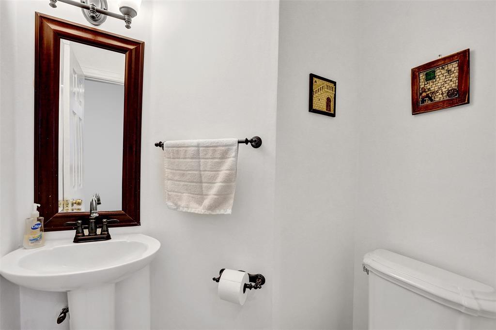 1415 Miami Road, Unit B Fort Lauderdale, FL 33316 - Photo 12 of 59 a bathroom with a toilet a sink and mirror