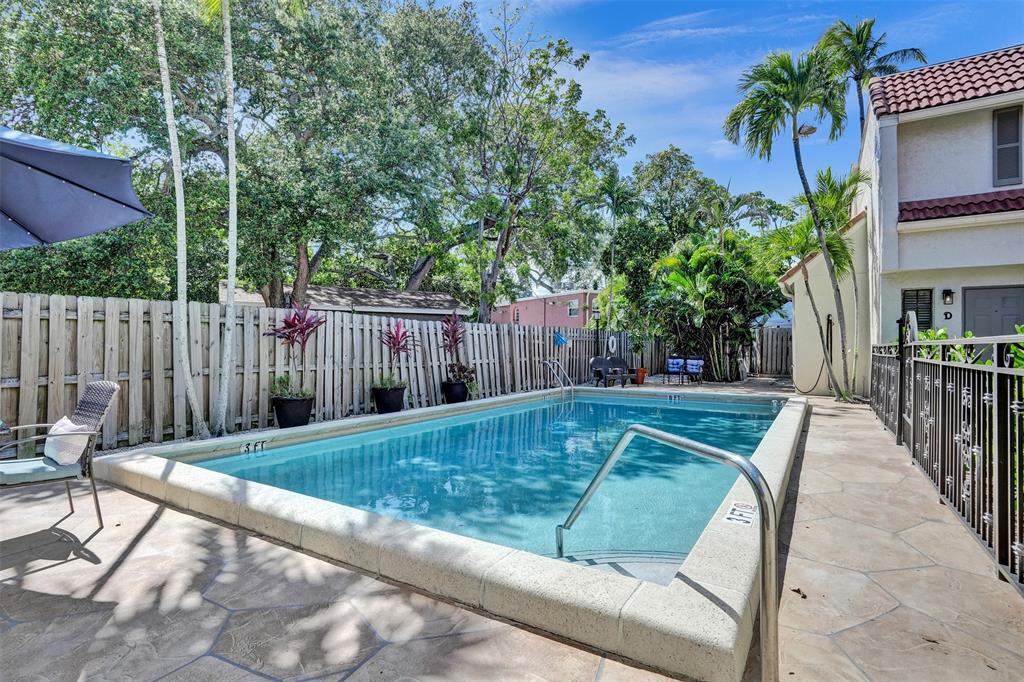 1415 Miami Road, Unit B Fort Lauderdale, FL 33316 - Photo 47 of 59 a view of backyard with swimming pool and outdoor seating