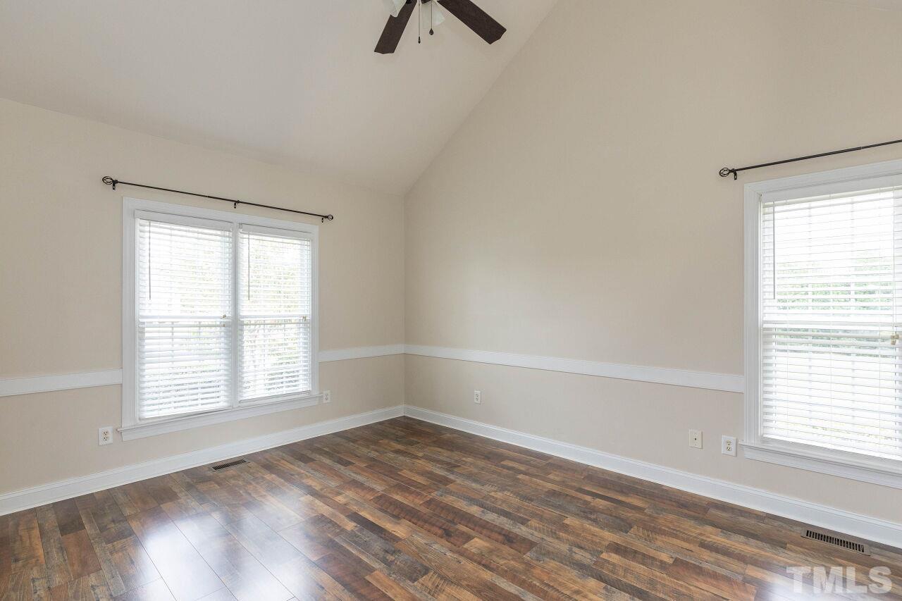 6573 Madison Road Bailey, NC 27807 - Photo 12 of 31 an empty room with a window and a ceiling fan