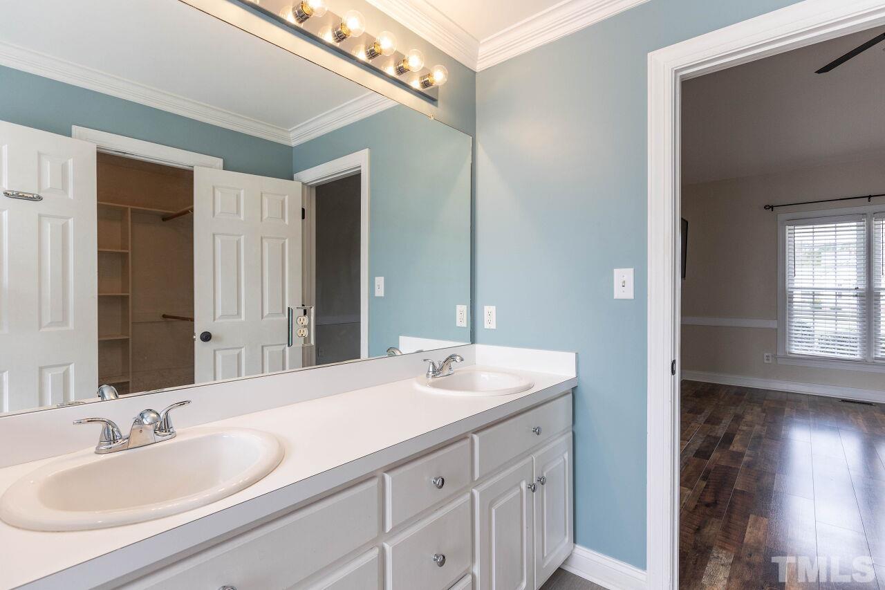 6573 Madison Road Bailey, NC 27807 - Photo 14 of 31 a bathroom with a sink double vanity and a mirror