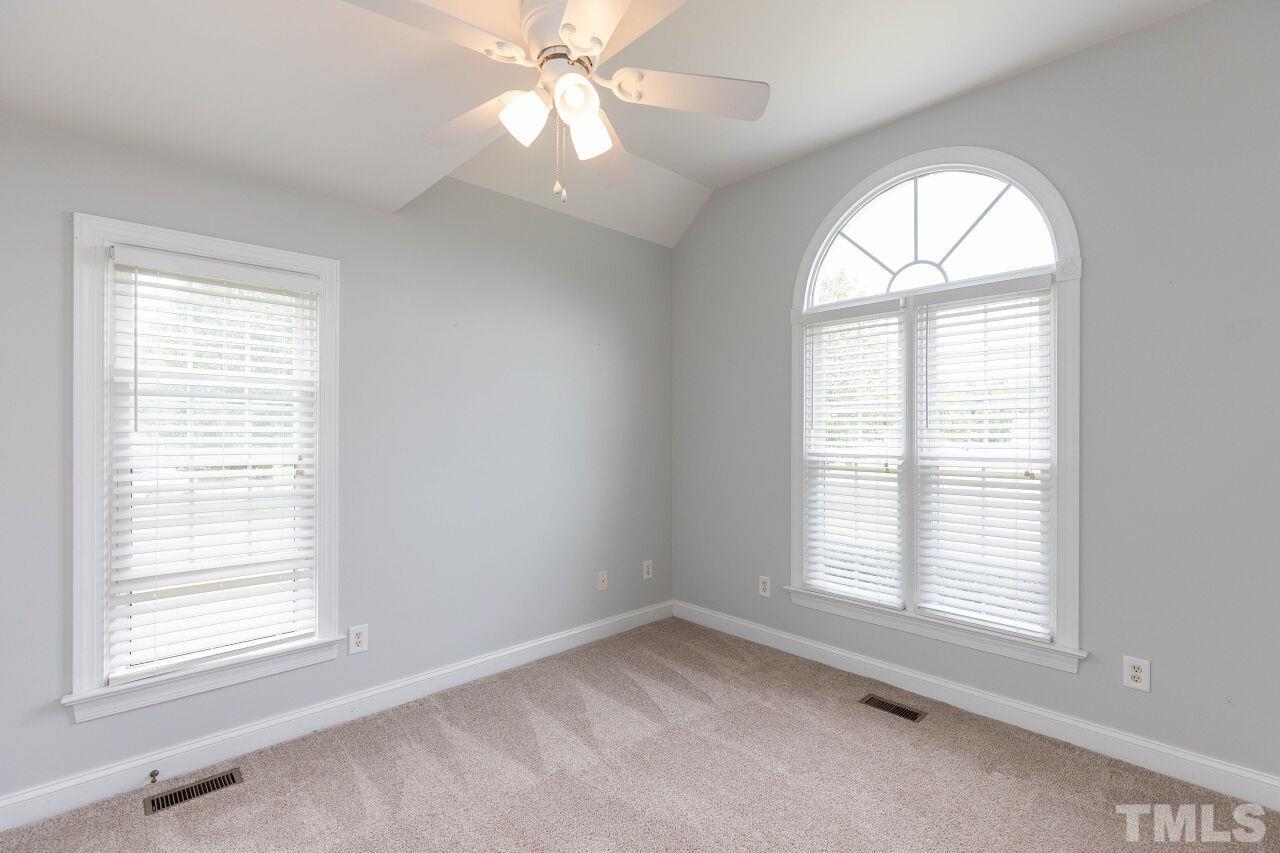 6573 Madison Road Bailey, NC 27807 - Photo 19 of 31 an empty room with a window and ceiling fan