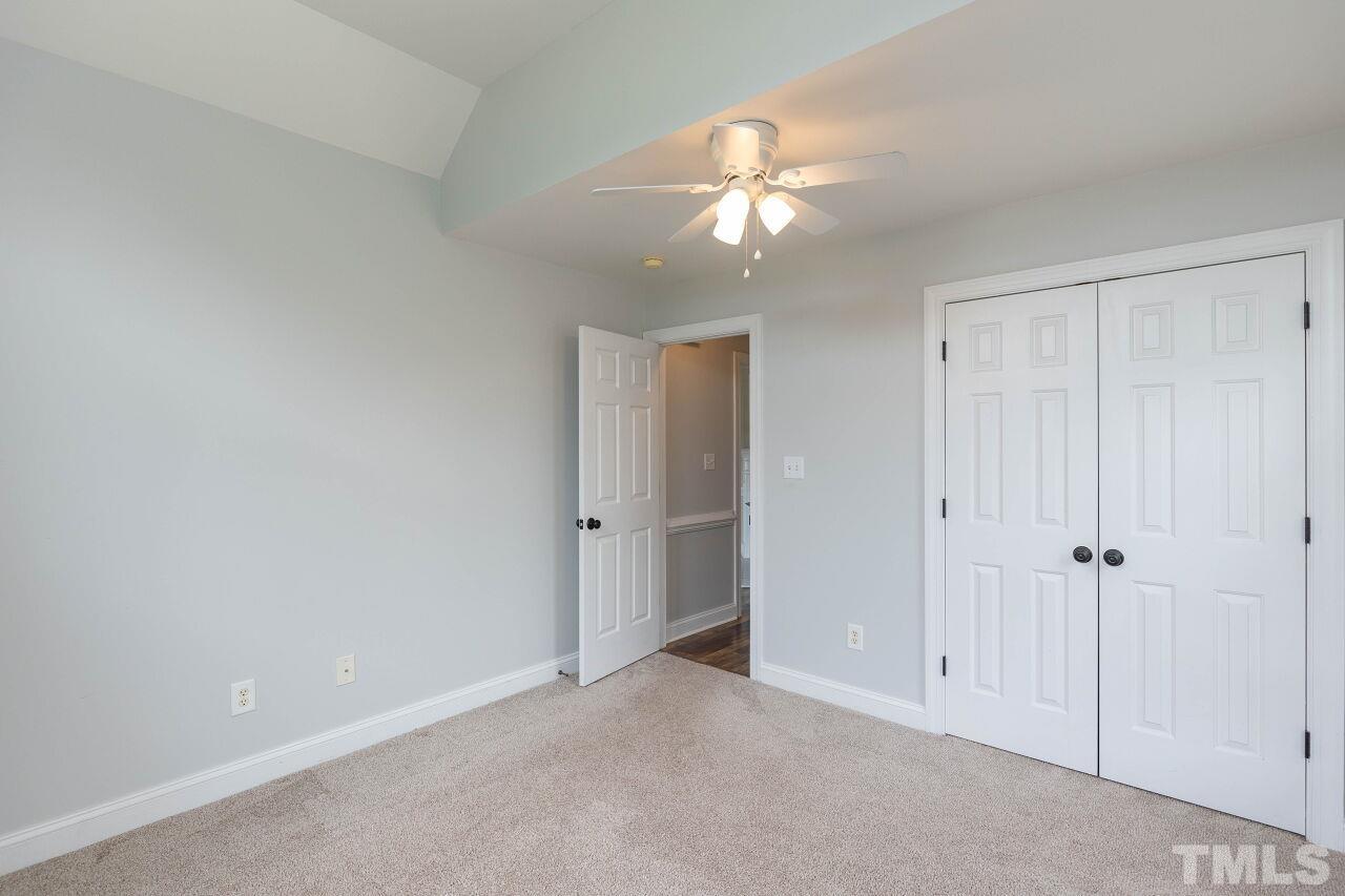 6573 Madison Road Bailey, NC 27807 - Photo 20 of 31 a view of an empty room and a chandelier fan
