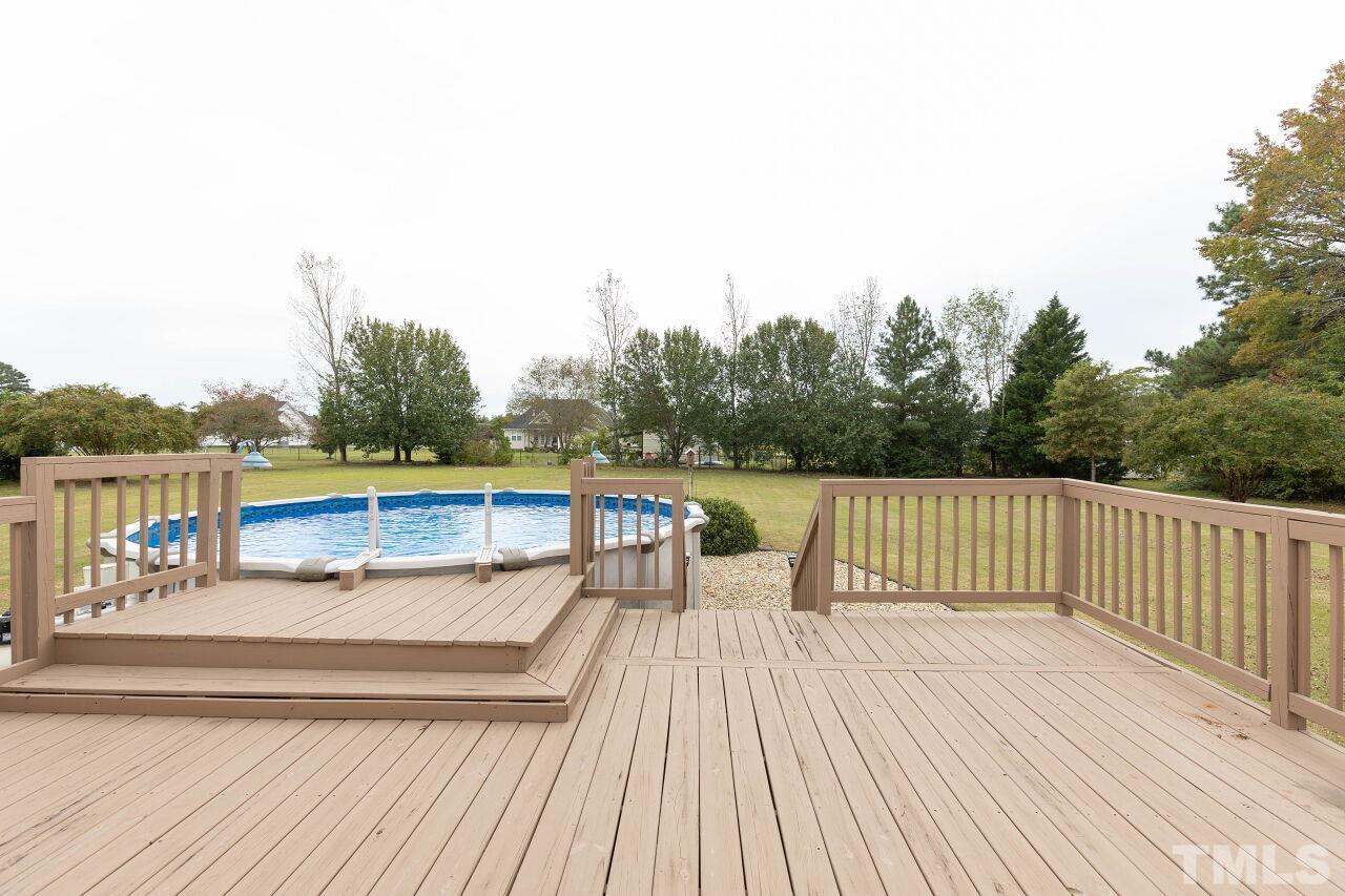 6573 Madison Road Bailey, NC 27807 - Photo 24 of 31 a view of balcony with wooden floor and lake view