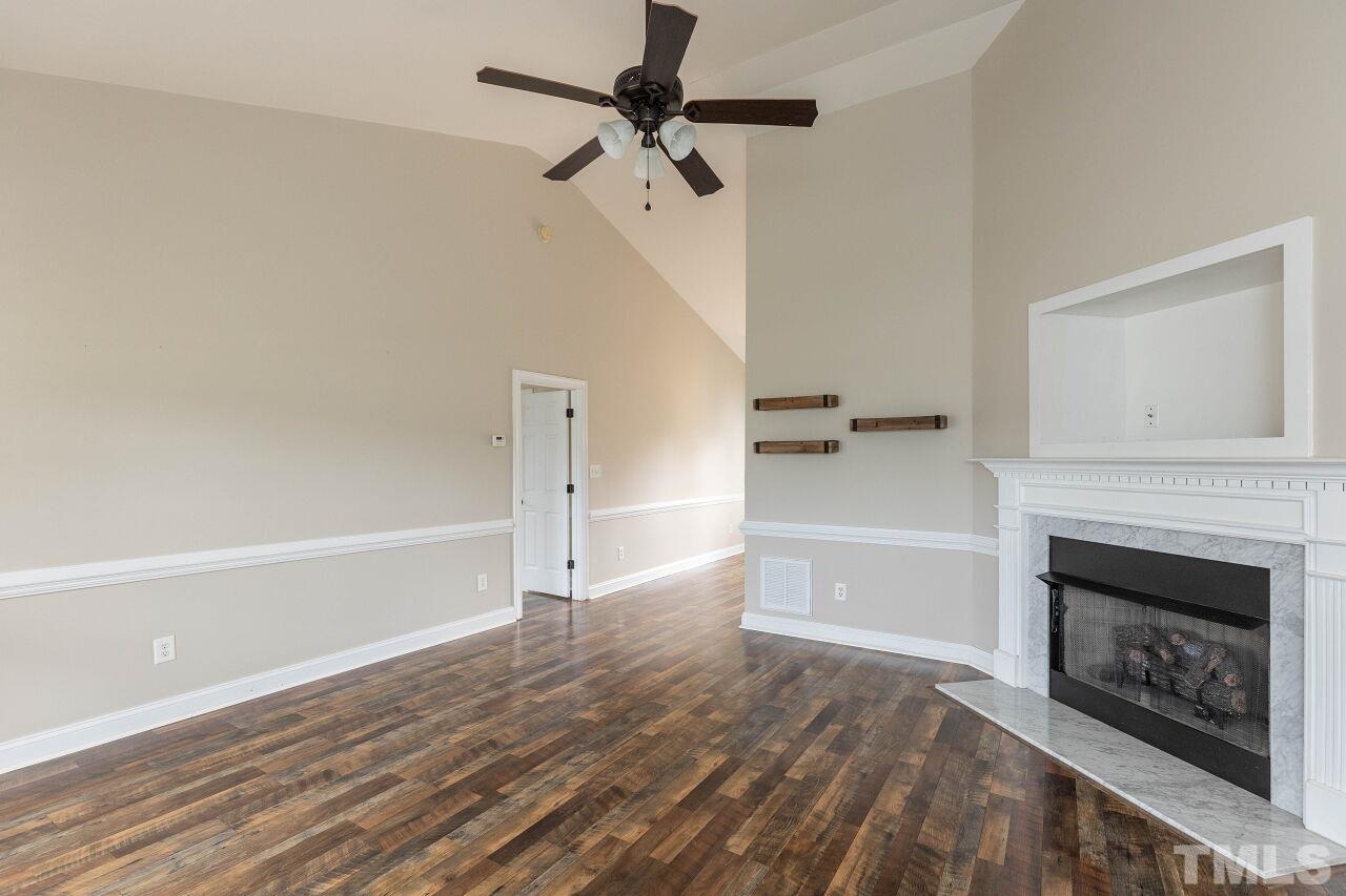 6573 Madison Road Bailey, NC 27807 - Photo 4 of 31 a view of an empty room and fire place