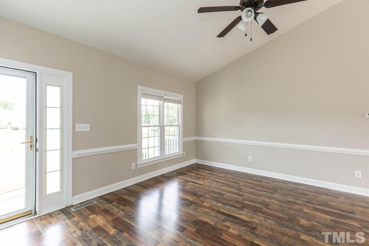 6573 Madison Road Bailey, NC 27807 - Photo 7 of 31 wooden floor in an empty room with a window