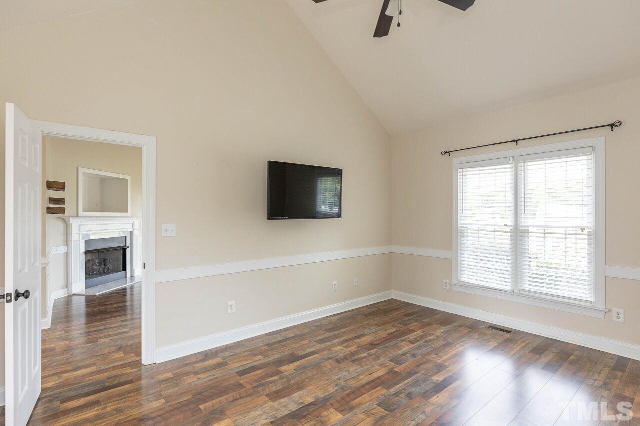 6573 Madison Road Bailey, NC 27807 - Photo 9 of 31 wooden floor in an empty room with a window