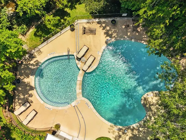 an aerial view of a swimming pool and outdoor space