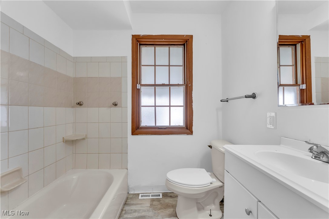5817 Turney Road Garfield Heights, OH 44125 - Photo 15 of 31 Bathroom with plenty of natural light and vanity