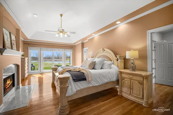 a bedroom with a bed and a night stand