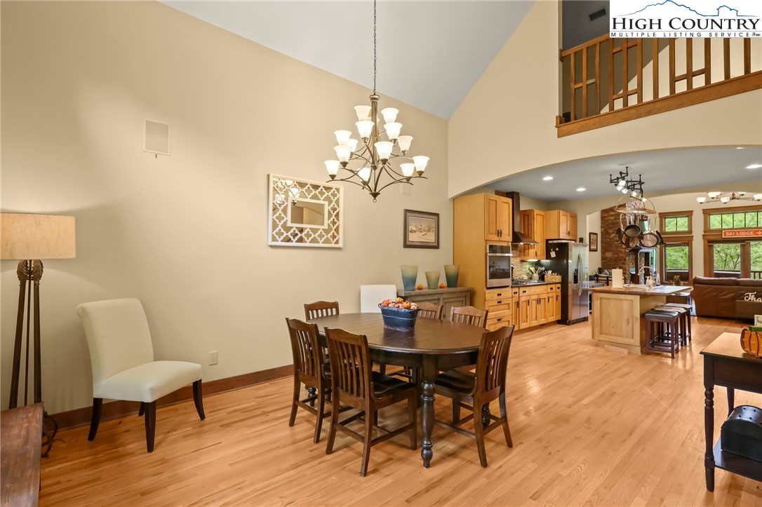 138 South Camp Road, Unit 103 Boone, NC 28607 - Photo 6 of 50 a view of a dining room with furniture and wooden floor