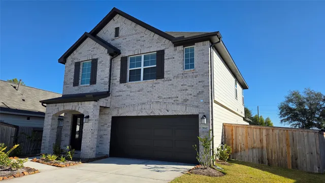 a front view of a house with yard