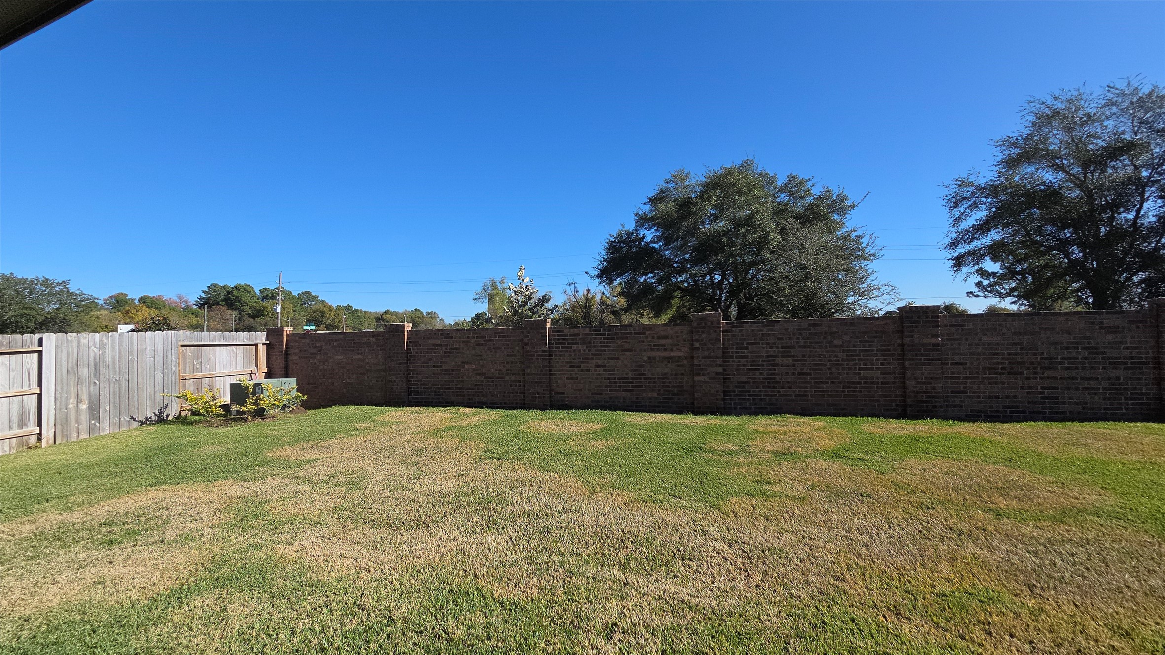 5847 Sunrise Btm Lane Fulshear, TX 77441 - Photo 21 of 21 a view of a yard with a house