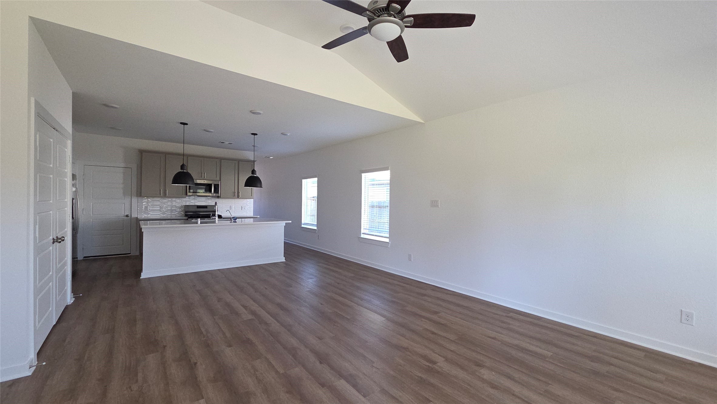 5847 Sunrise Btm Lane Fulshear, TX 77441 - Photo 6 of 21 a view of a living room hardwood floor and a ceiling fan