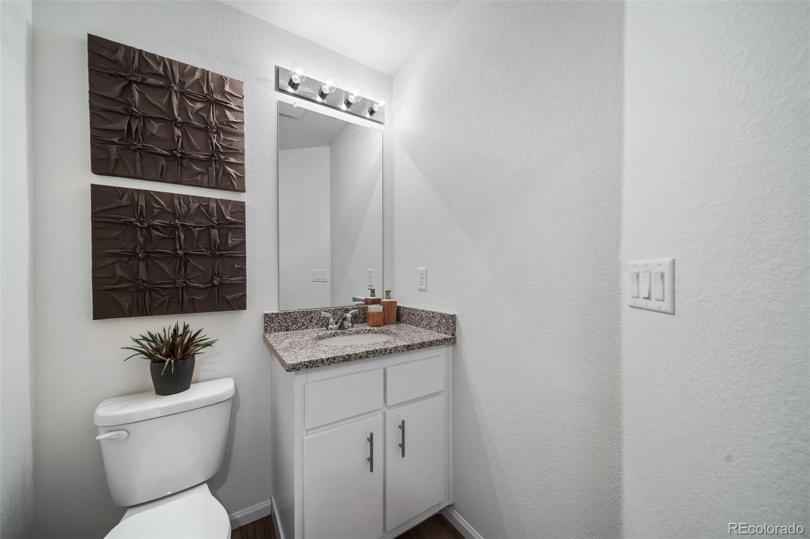 3372 Baltin Road Johnstown, CO 80534 - Photo 21 of 24 a bathroom with a toilet a sink and shower