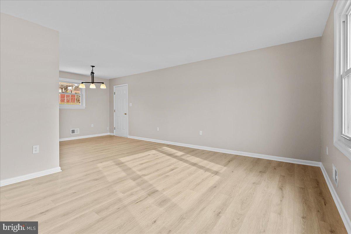 6812 Fulford Street Clinton, MD 20735 - Photo 6 of 32 wooden floor in an empty room