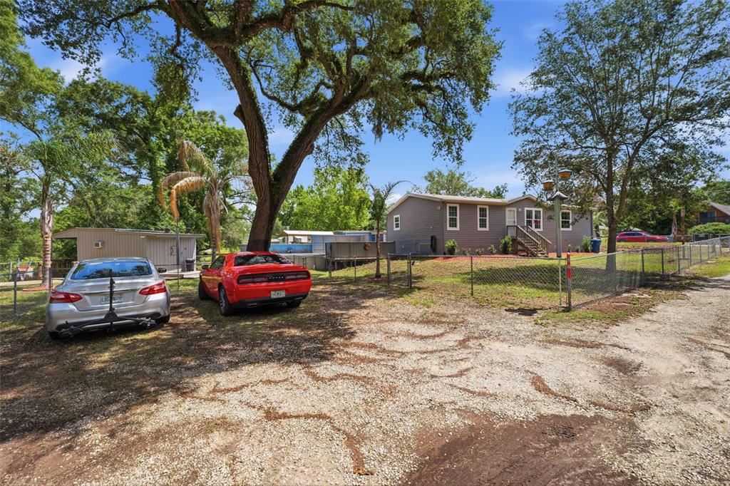 3183 Cedley Road Dade City, FL 33523 - Photo 42 of 48 a view of a house with a back yard