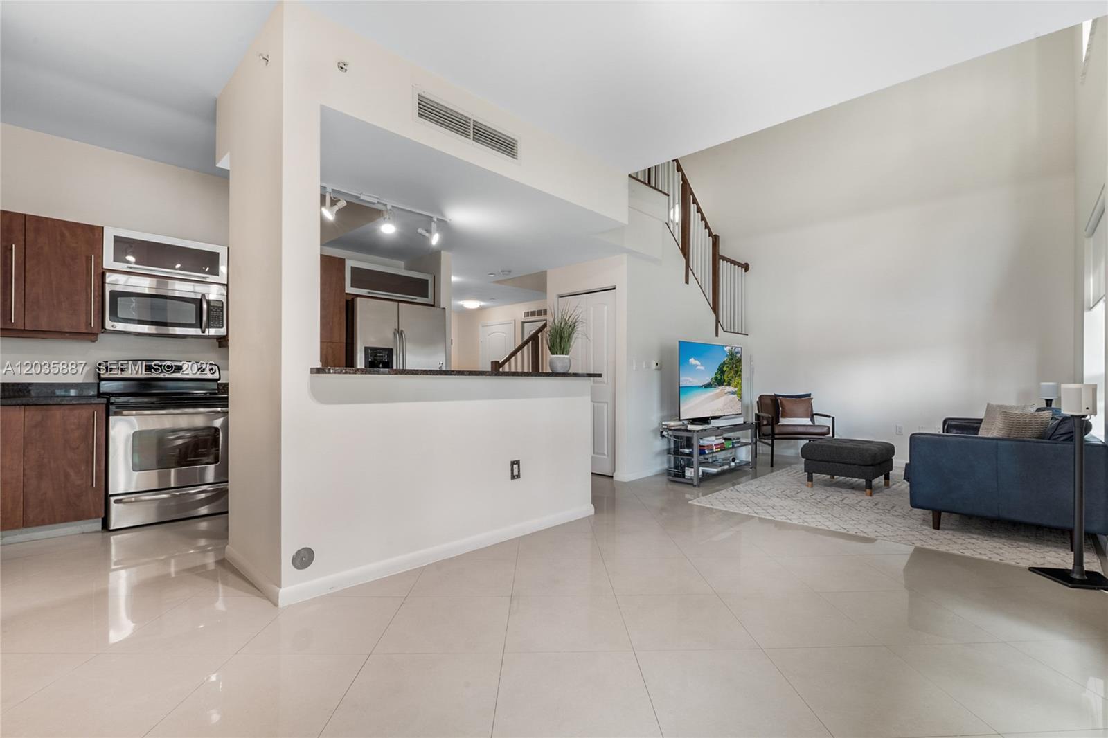 7375 Southwest 90th Street, Unit TH107 Miami, FL 33156 - Photo 3 of 18 Dining room and Living