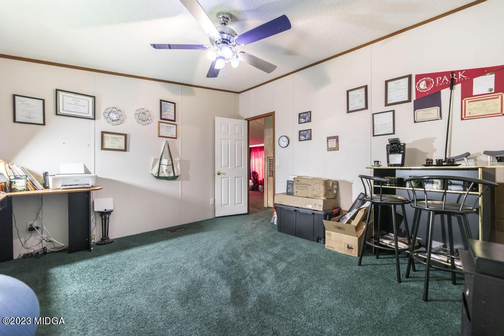1592 Tribble Road Fort Valley, GA 31030 - Photo 13 of 30 a living room with furniture and kitchen view