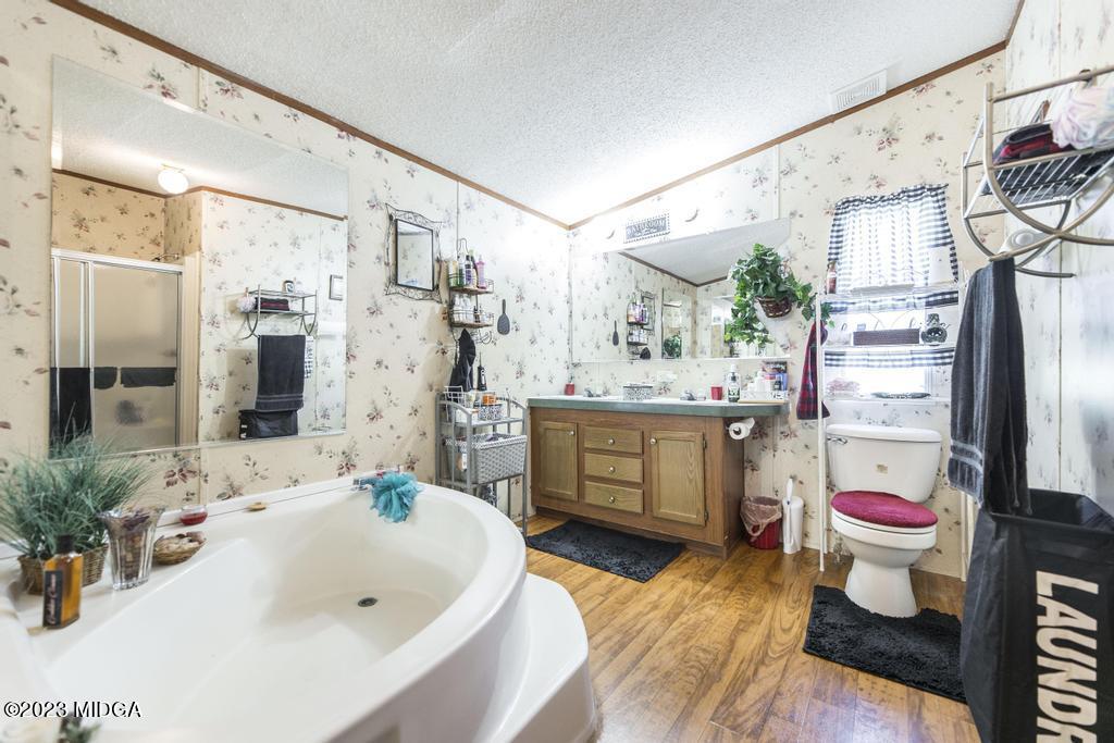 1592 Tribble Road Fort Valley, GA 31030 - Photo 18 of 30 a bathroom with a sink mirror and a bathtub