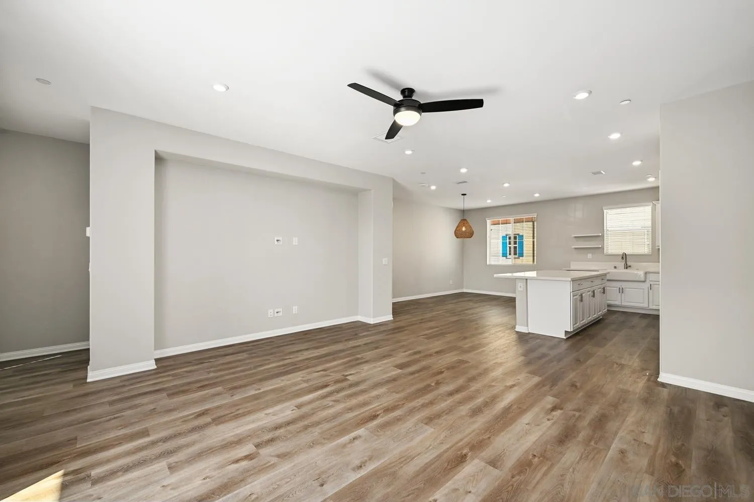 1515 Fig Tree Way Oceanside, CA 92056 - Photo 11 of 27 a view of a livingroom with a ceiling fan & window