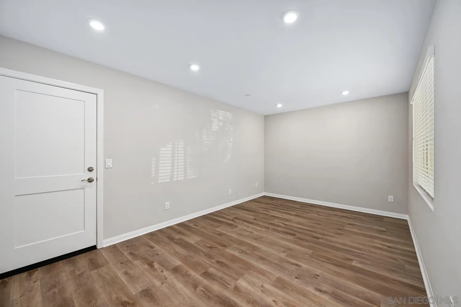 1515 Fig Tree Way Oceanside, CA 92056 - Photo 13 of 27 an empty room with wooden floor and closet