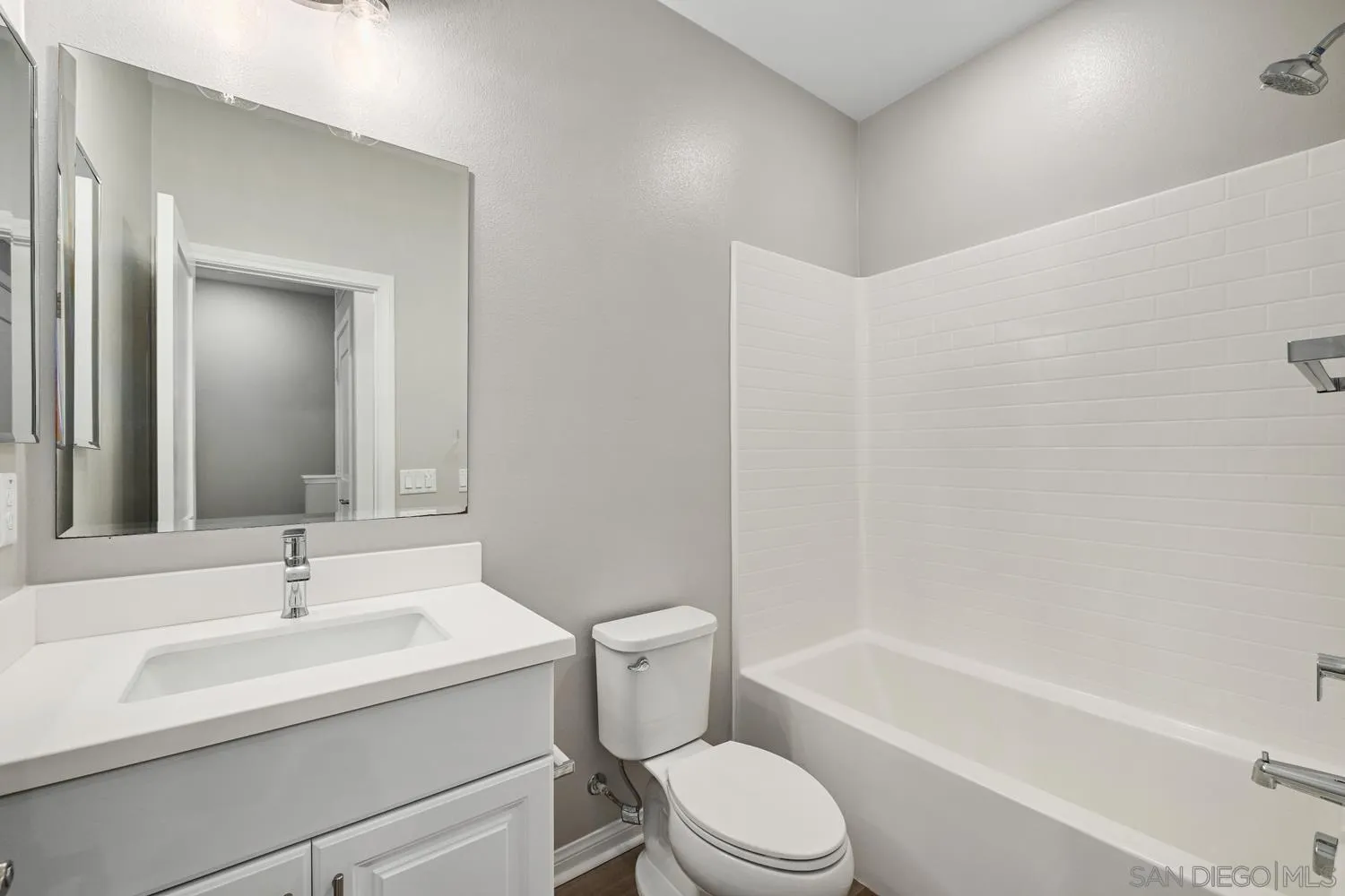 1515 Fig Tree Way Oceanside, CA 92056 - Photo 19 of 27 a bathroom with a sink toilet and a bathtub