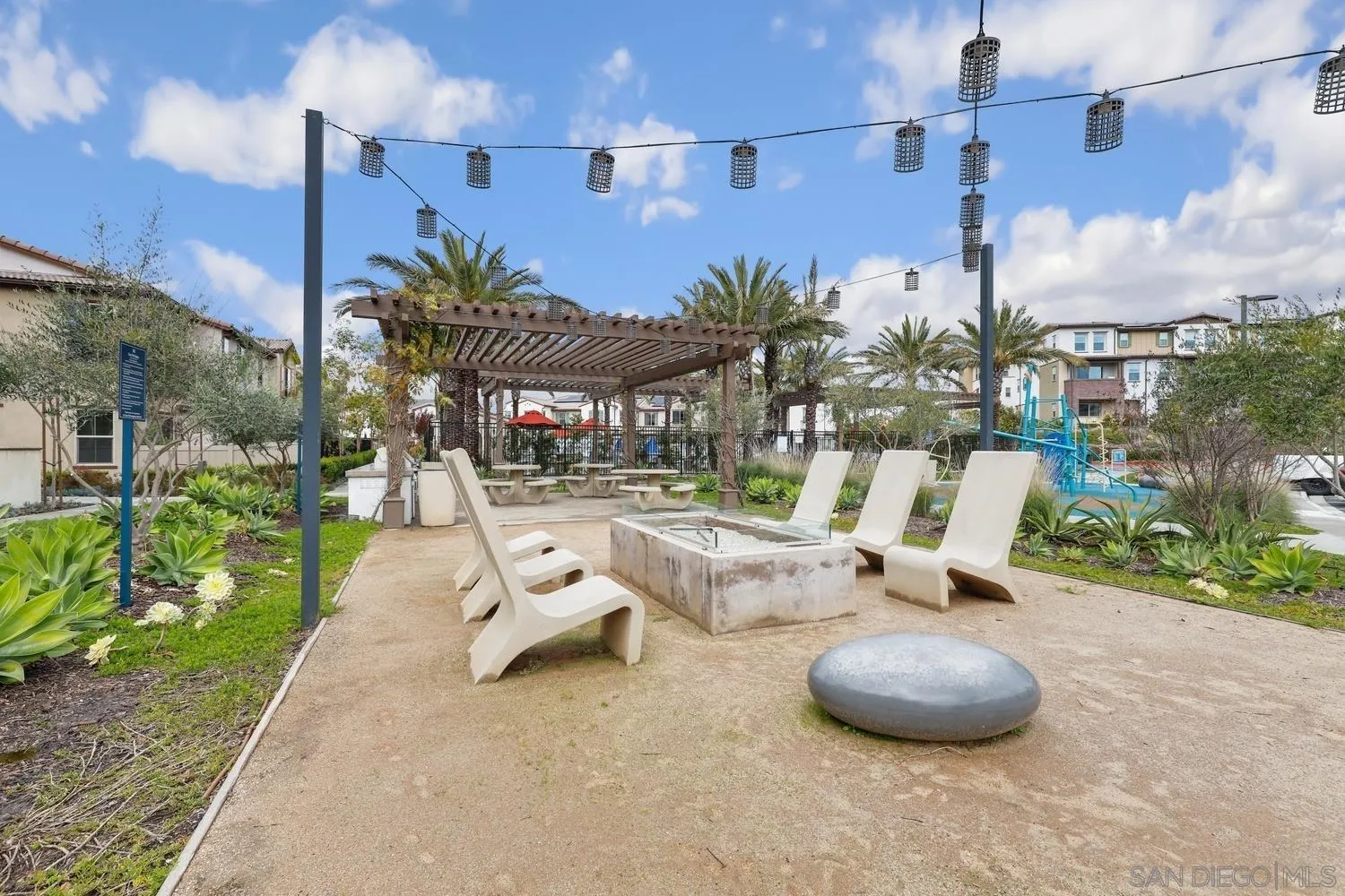 1515 Fig Tree Way Oceanside, CA 92056 - Photo 24 of 27 a view of a patio with table and chairs potted plants