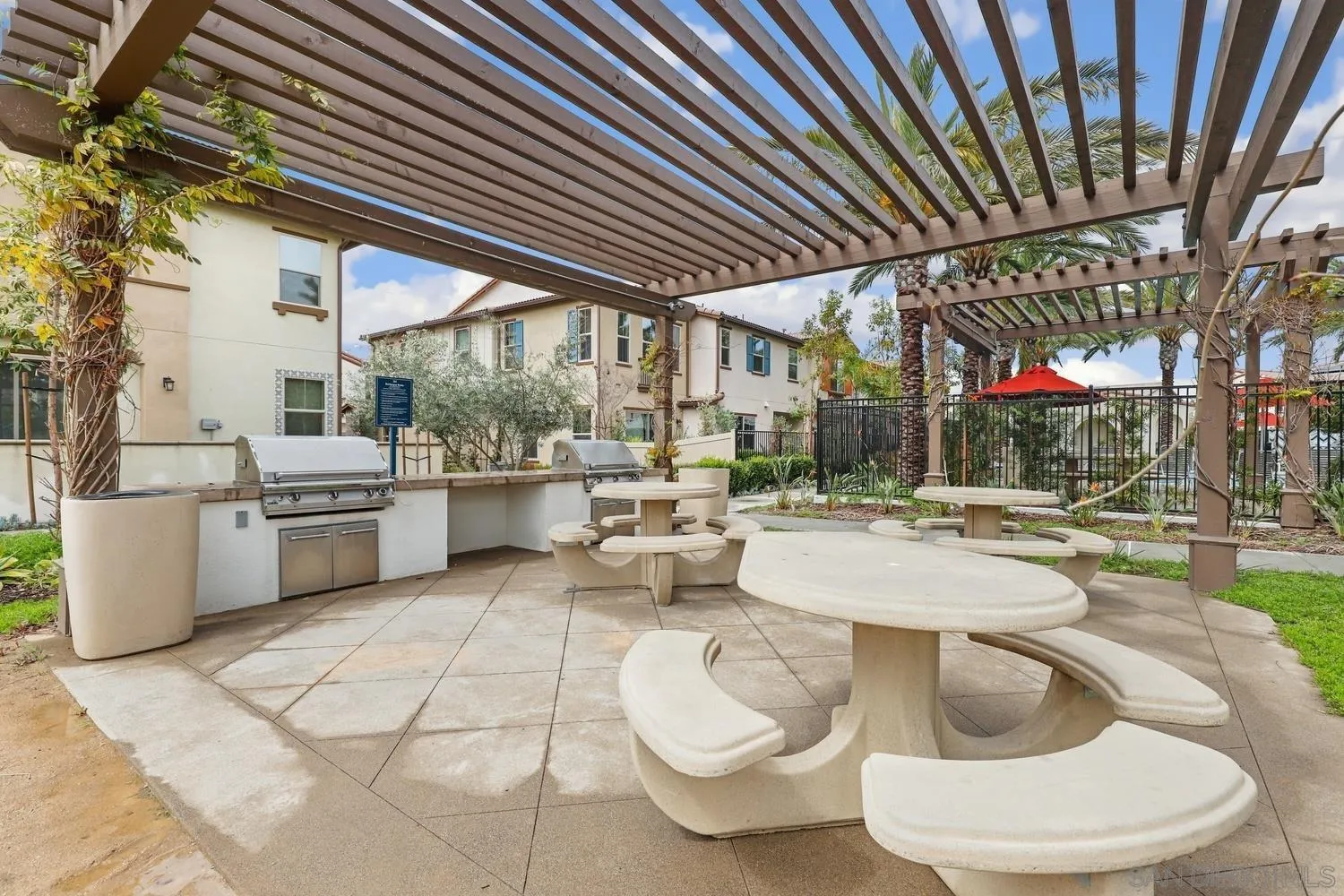 1515 Fig Tree Way Oceanside, CA 92056 - Photo 27 of 27 a room with fireplace and lots of white furniture