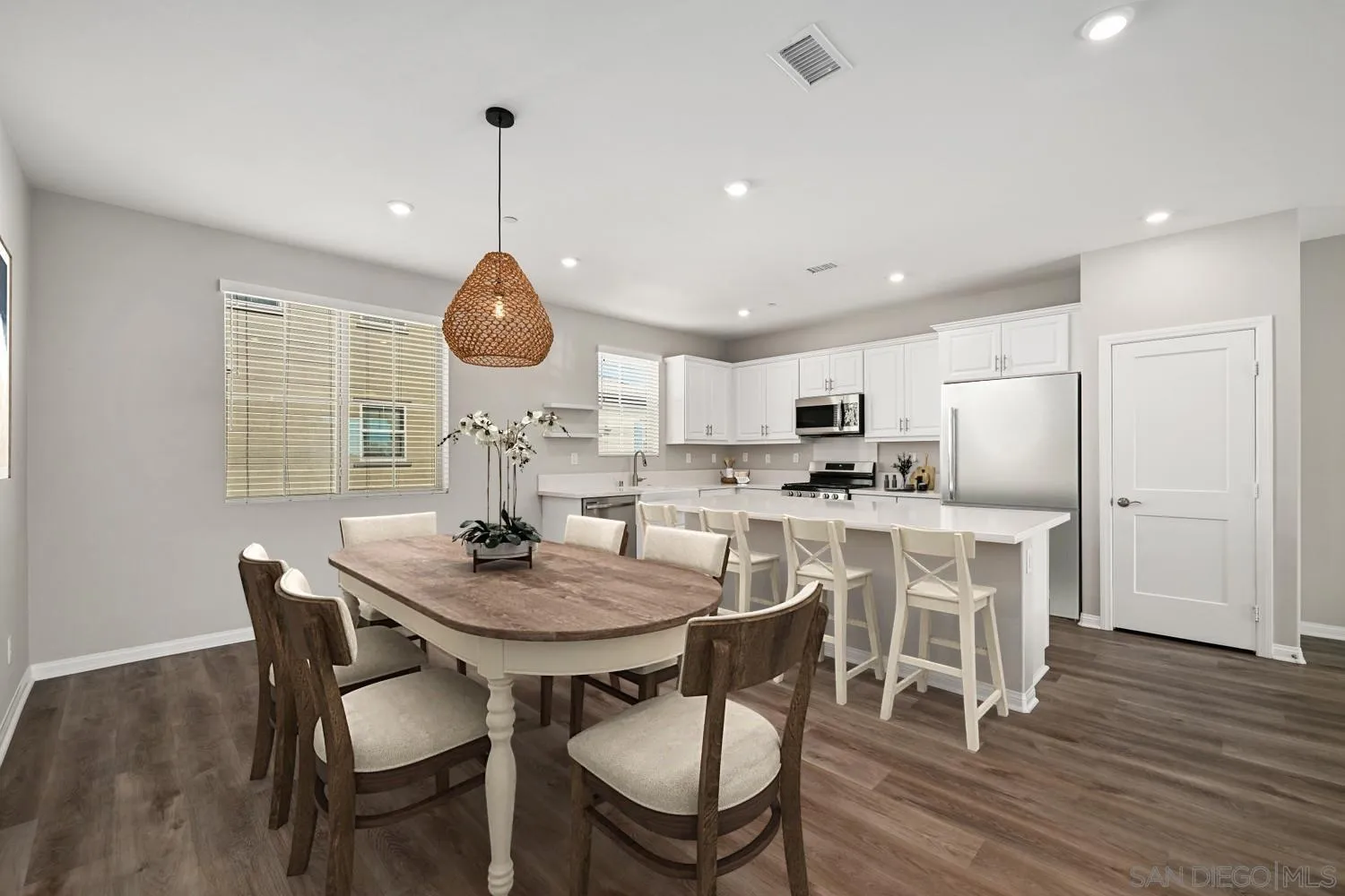 1515 Fig Tree Way Oceanside, CA 92056 - Photo 9 of 27 a dining room with furniture and wooden floor