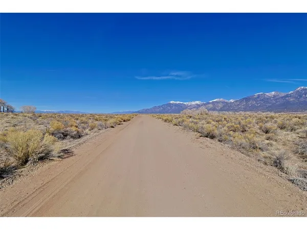 a view of an outdoor space and a mountain