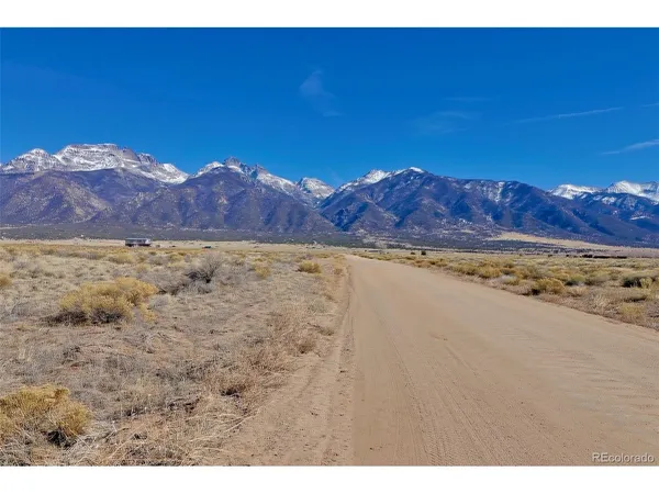 a view of a dry yard with wooden floor