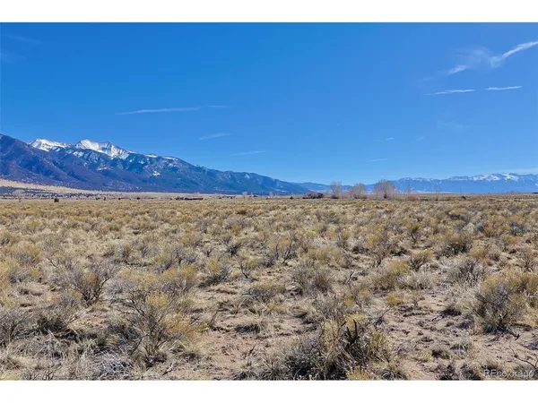 a view of a large screen with a building in the background