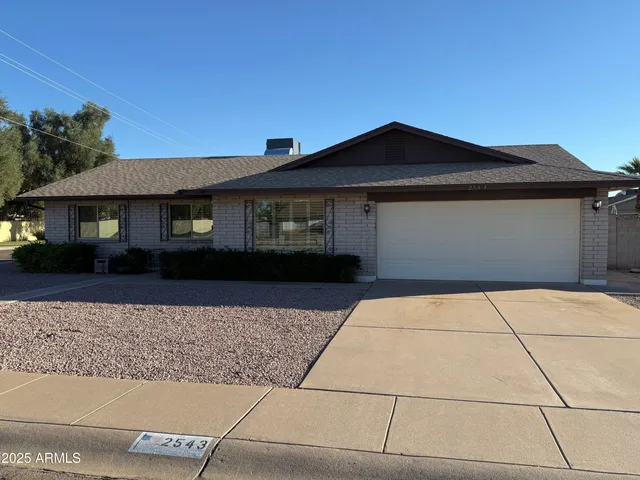 a front view of a house with yard