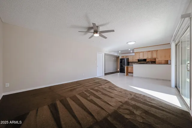 a bathroom with a granite countertop sink toilet a shower a mirror and bathtub