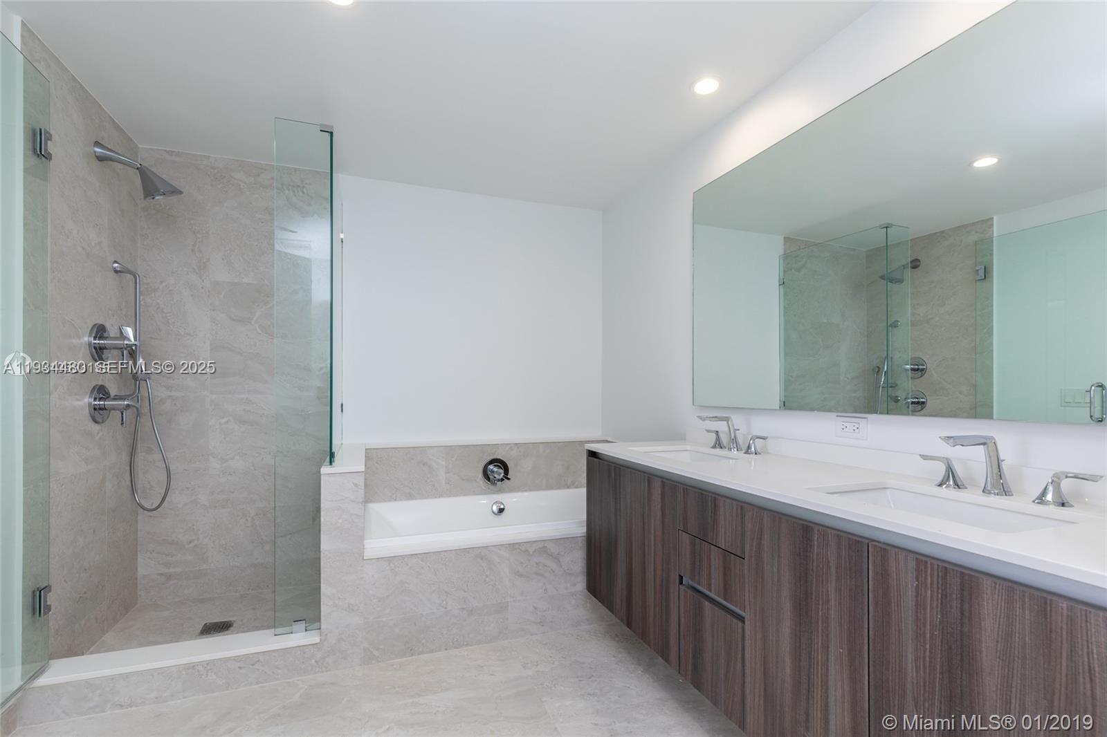 488 Northeast 18th Street, Unit 1600 Miami, FL 33132 - Photo 23 of 34 a bathroom with a double vanity sink mirror double and shower