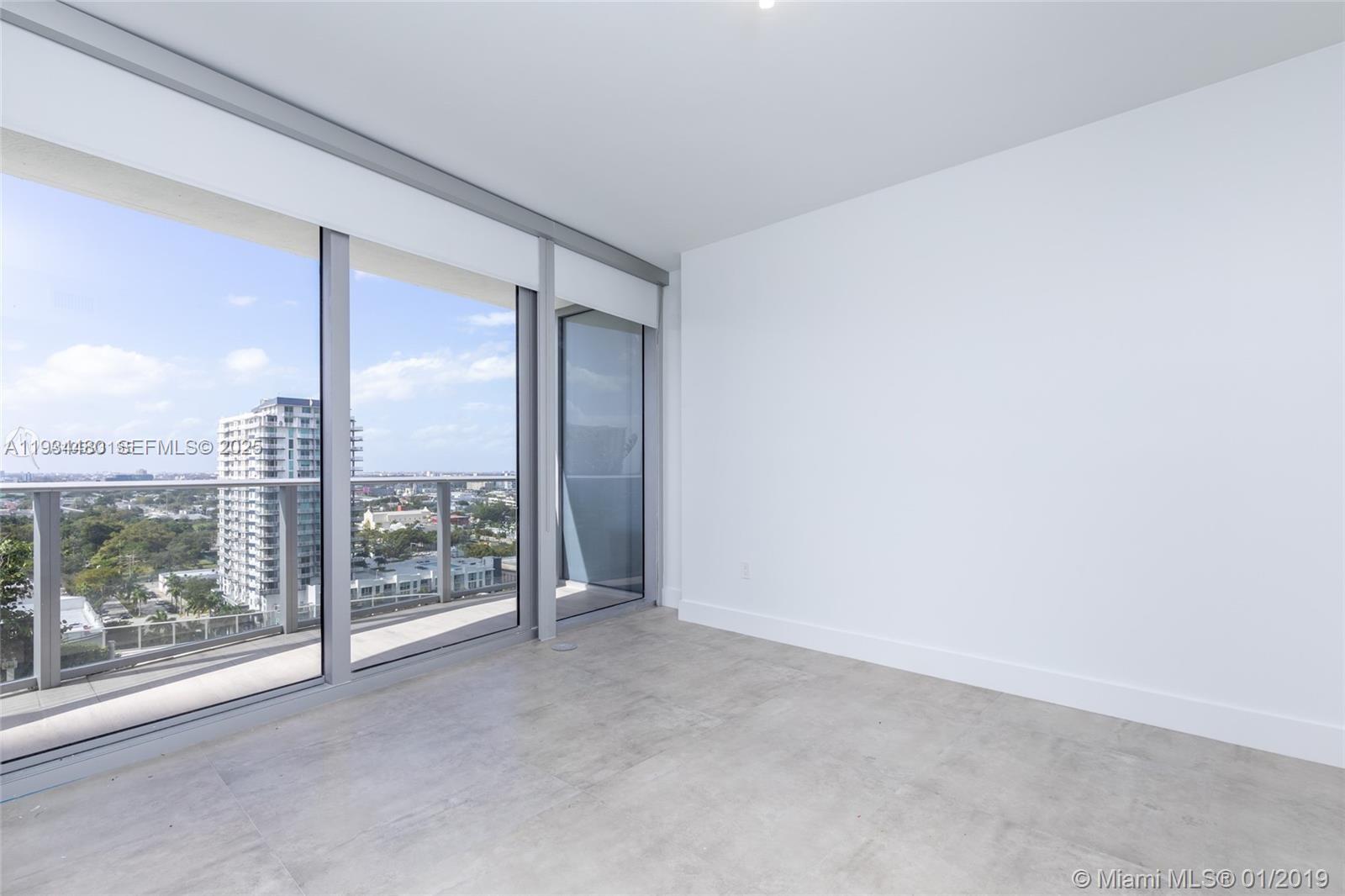 488 Northeast 18th Street, Unit 1600 Miami, FL 33132 - Photo 25 of 34 a view of a room with sliding glass door