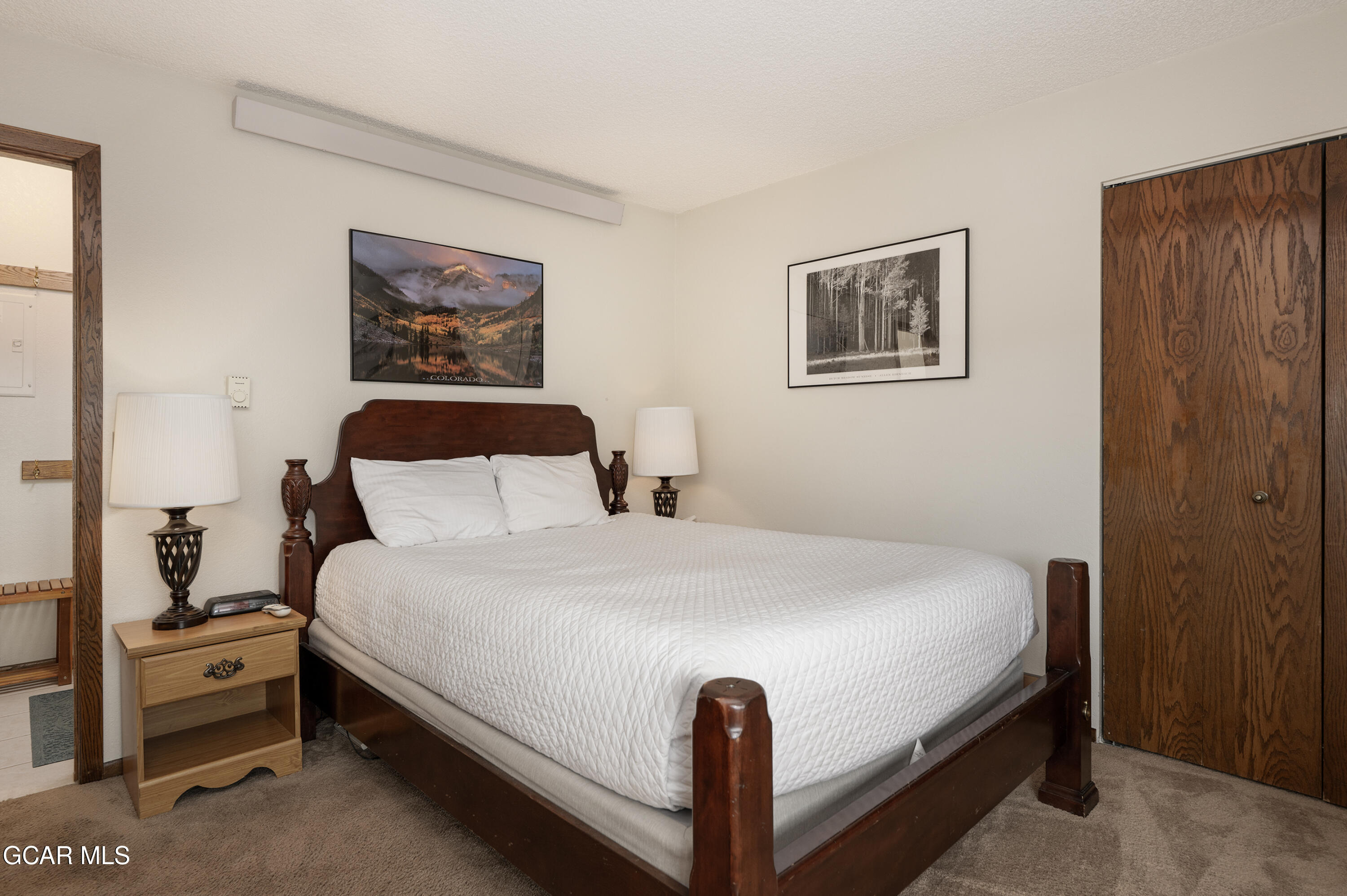 490 Kings Crossing Road, Unit 331 Winter Park, CO 80482 - Photo 10 of 38 a bedroom with a bed and a night stand